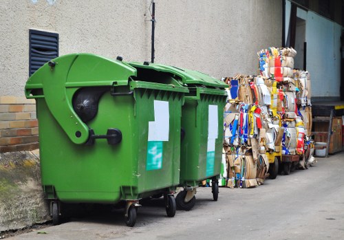Workers loading mixed commercial waste into a vehicle